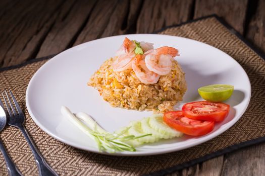 Thai fried rice with prawns in a white plate