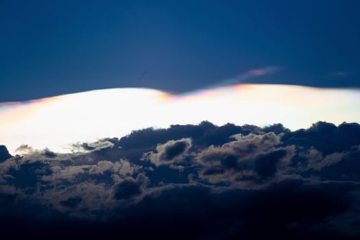 Cloud iridescence, diffraction phenomenon produce very vivid color and make cloud shine like a corona.