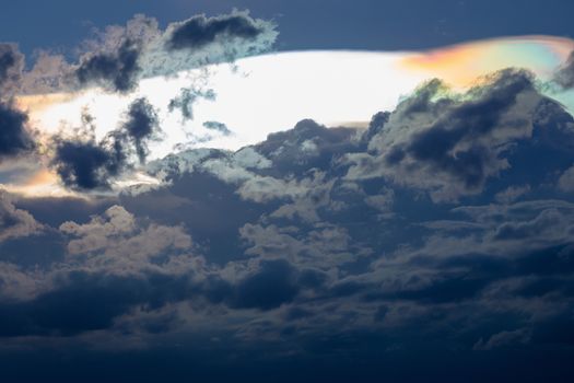 Cloud iridescence, diffraction phenomenon produce very vivid color and make cloud shine like a corona.