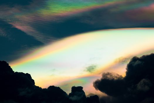 Cloud iridescence, diffraction phenomenon produce very vivid color and make cloud shine like a corona.