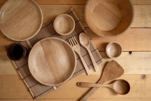 Wooden kitchenware on Natural pattern wood background. top view.