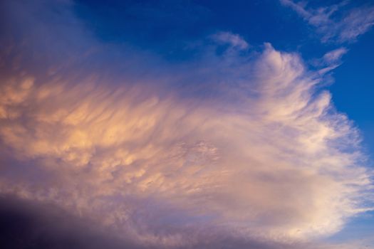 Colorful dramatic sky with cloud at sunset.