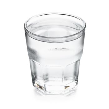 Pure water in glass isolated on a white background.