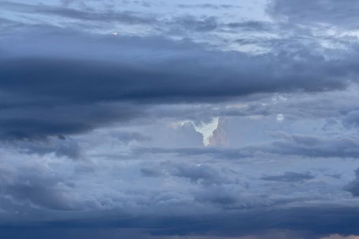 Dramatic sky with stormy clouds before rain and thunderstorm.