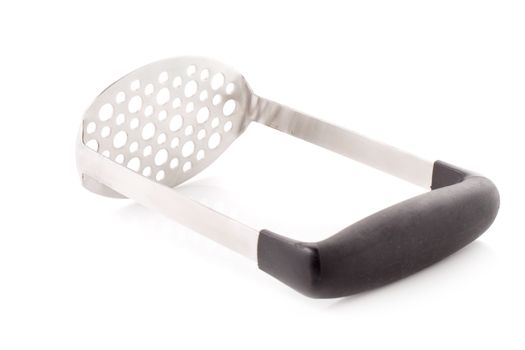 Metal potato masher isolated on a white background.