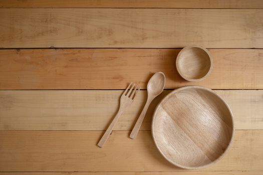 Wooden kitchenware on Natural pattern wood background. top view.