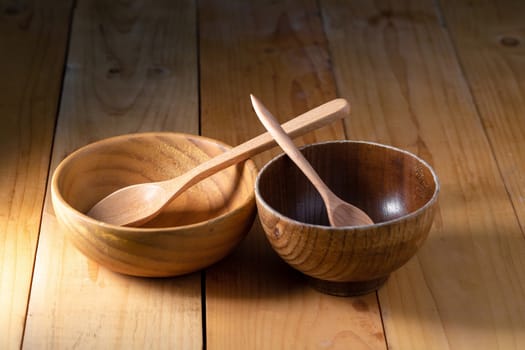 Wooden Tableware Set on a wooden background. 