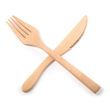 Set of wooden cutlery isolated on a white background.