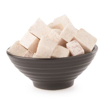 Black bowl of Cube taro root isolated on a white background.