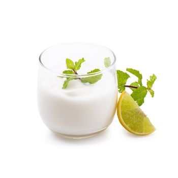 Glass of lemon yogurt isolated on a white background.