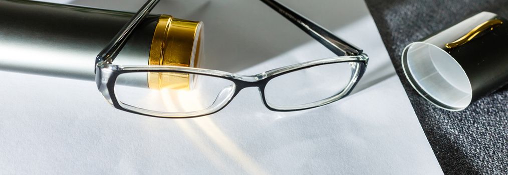 Glasses on paper with the engineer's office.