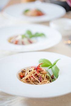 Spaghetti with Thai-style sauce with clams and chilli.