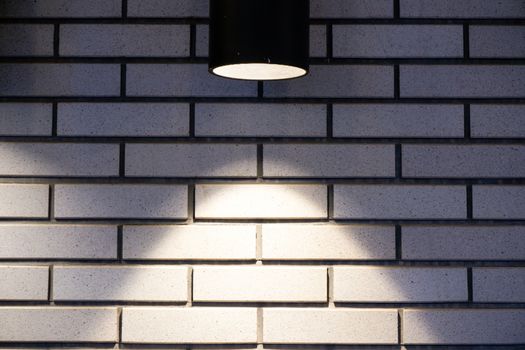 Brick wall with a lamp background