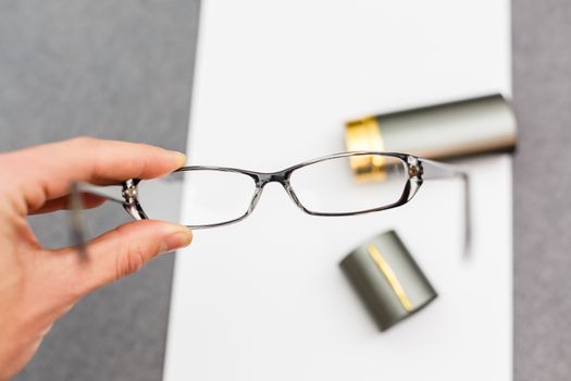 Magnifier,glasses and notebook