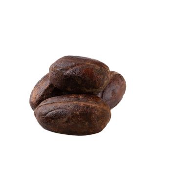 Dry nutmeg spice isolated on a white background.