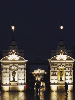 Exterior facade of classic building in the European city at night, architecture and design detail