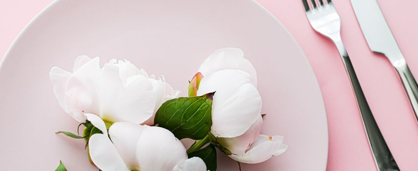 Dining plate and cutlery with peony flowers as wedding decor set on pink background, top tableware for event decoration and menu branding design