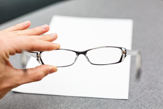 Glasses on paper with the engineer's office.