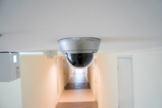 CCTV security camera monitor in office building