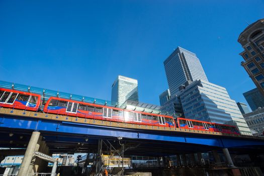 LONDON ENGLAND - APRIL 14, 2015: DLR (Dockland Light Railways) is  opened in 1987 to link all dockland areas.  This picture is taken in the business zone, Canary Wharf, in London
