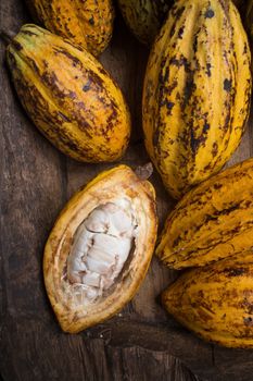 Cacao fruit, raw cacao beans, Cocoa pod on wooden background.