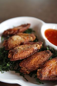 Fried chicken on wood background