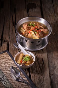 Chicken and herb soup in pot.