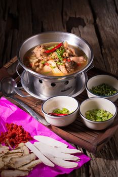 Chicken and herb soup in pot.