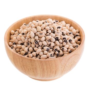 Black-eyed peas in a wooden bowl isolated on a white background.