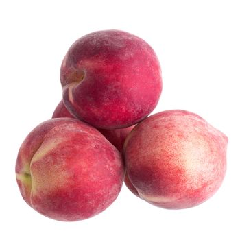 Ripe fresh peaches isolated on white background.
