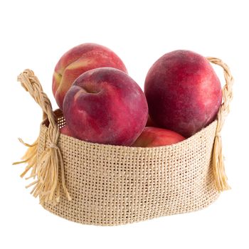 Ripe fresh peaches isolated on white background.