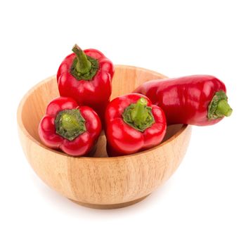 red chilli vegetable in Wooden bowl Isolated on white background.