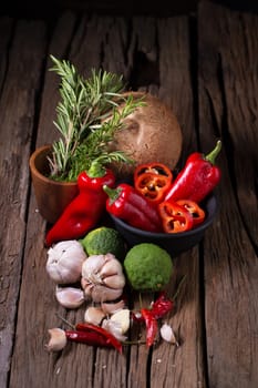 Spices and herbs on wooden background.
