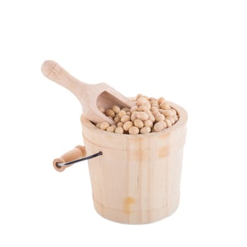 Soybeans in a wooden cup isolated on white background.