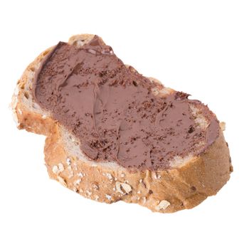 Chocolate creamy spread on brown whole wheat bread slice isolated on white background.