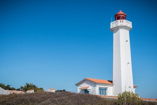 Port Joinville, France - September 17, 2018 - Architectural detail of the Corbeaux Marine Lighthouse on a summer day