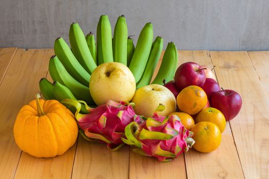 Fruits diet concept. different fruits on wooden table.