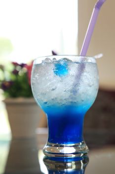 blue cocktail martini with flower
