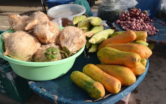 Papaya, coconut, corn, On the basket for sale in the rural market in Thailand.