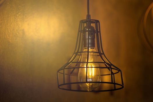 Decorative antique edison style light bulbs against brick wall background.