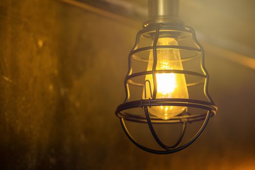 Decorative antique edison style light bulbs against brick wall background.