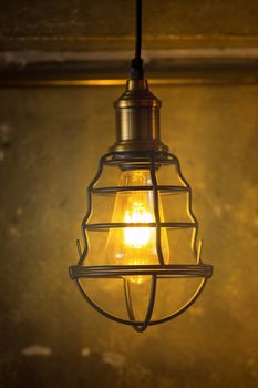 Decorative antique edison style light bulbs against brick wall background.