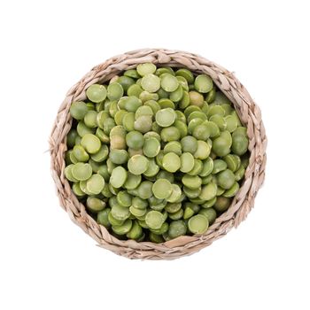 Split Green Peas in basket isolated on white background.