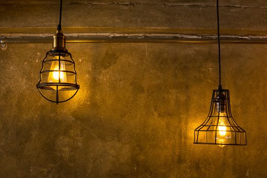 Decorative antique edison style light bulbs against brick wall background.