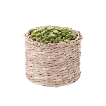 Split Green Peas in basket isolated on white background.