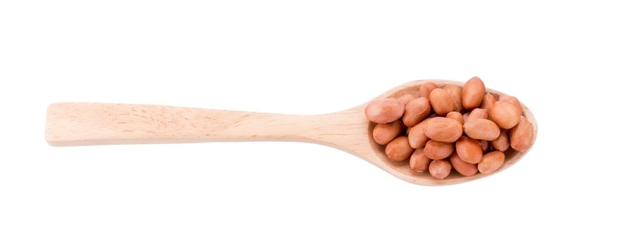 Peanuts in wooden spoon isolated on white background.