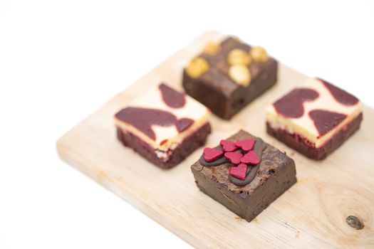 mini brownie on wooden board isolated on white background.