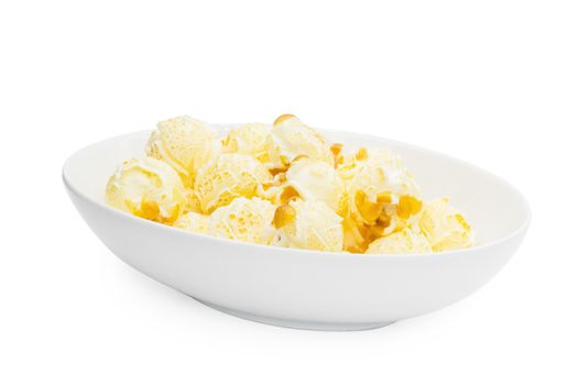 Popcorn in a plate isolated on white background.