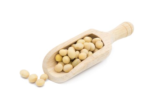 Soybean in wooden scoop isolated on white background.