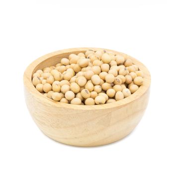 Soybeans in a wooden bowl on a white background.